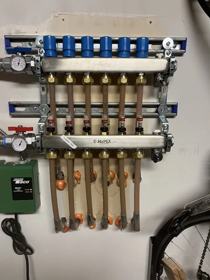 Plumber performing Water Heater Repair at a residential property in Pittsfield